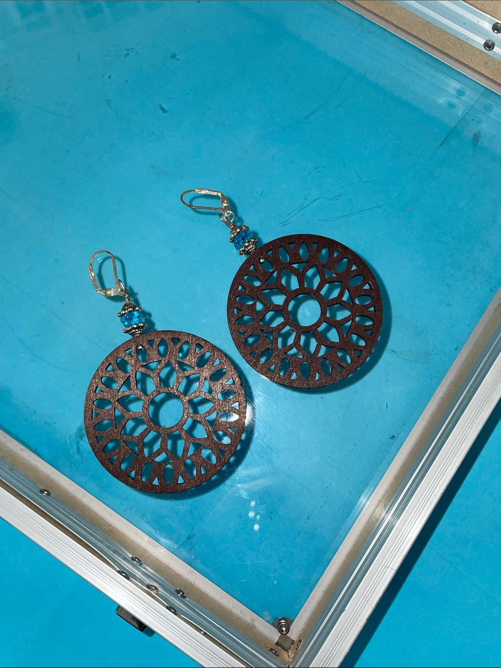 Handcrafted Brown Filigree Wooden Drop Earrings with Blue Accent Beads